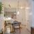 a living room with a table and chairs