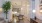 a living room with a table and chairs