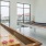 a room with a pool table and a window with a view