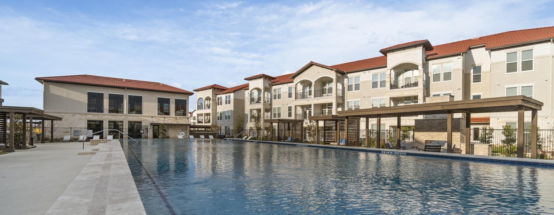 a pool of water with buildings around it