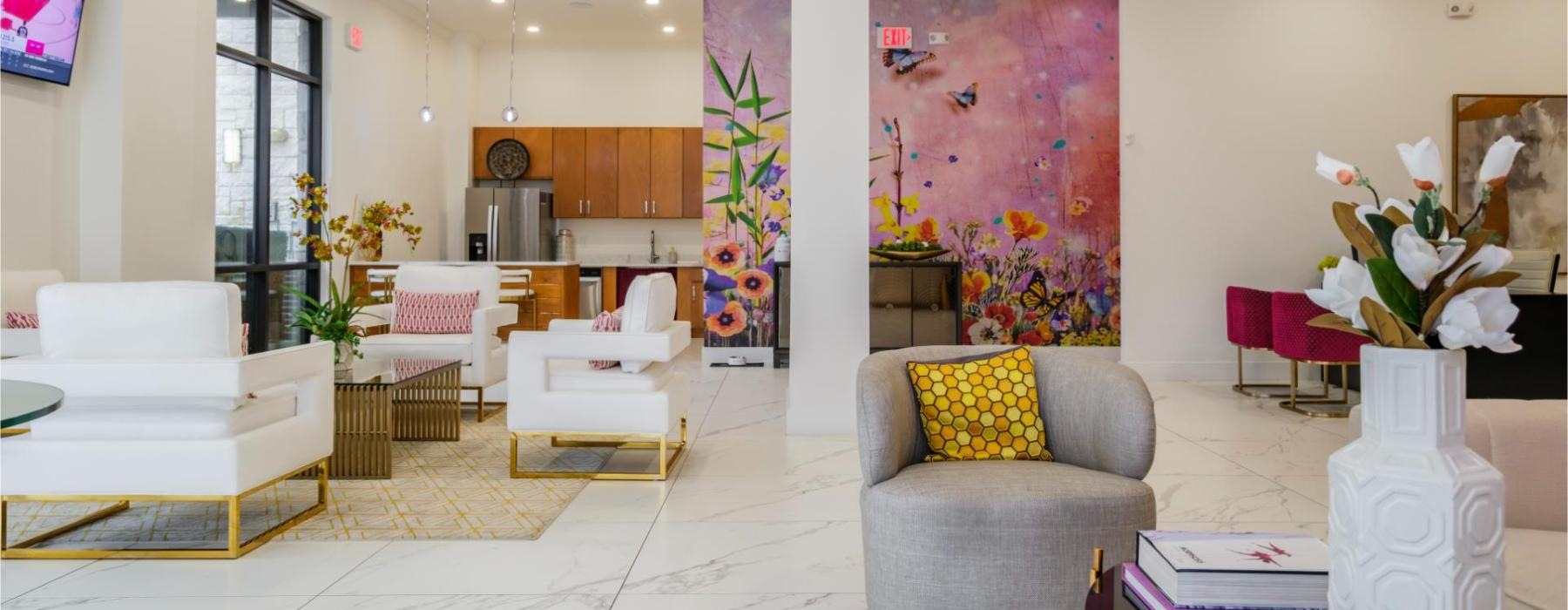 a room with a couch and chairs