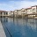 a pool of water with buildings around it