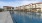 a pool of water with buildings around it