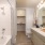a bathroom with a tub sink and shower