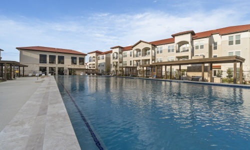 a pool of water with buildings around it