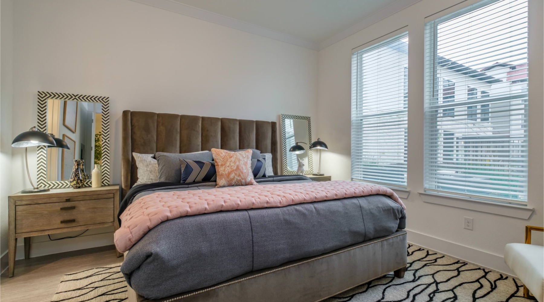 Sleep in style bedroom with nightstands and a large window