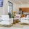a room with white couches and a table