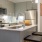 a kitchen with white cabinets